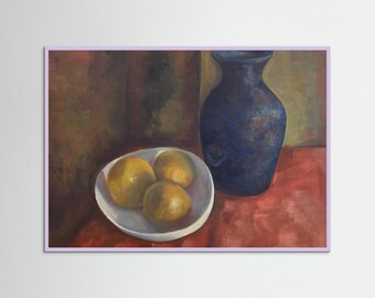 Quiet still life with three oranges in a simple white bowl beside a deep blue vase. Warm, muted tones and bright fruit create a calm balance