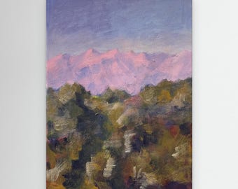 Serene greek mountain range bathed in soft pink hues against a calm blue med sky, forest of rich, earthy tones a tranquil natural landscape.
