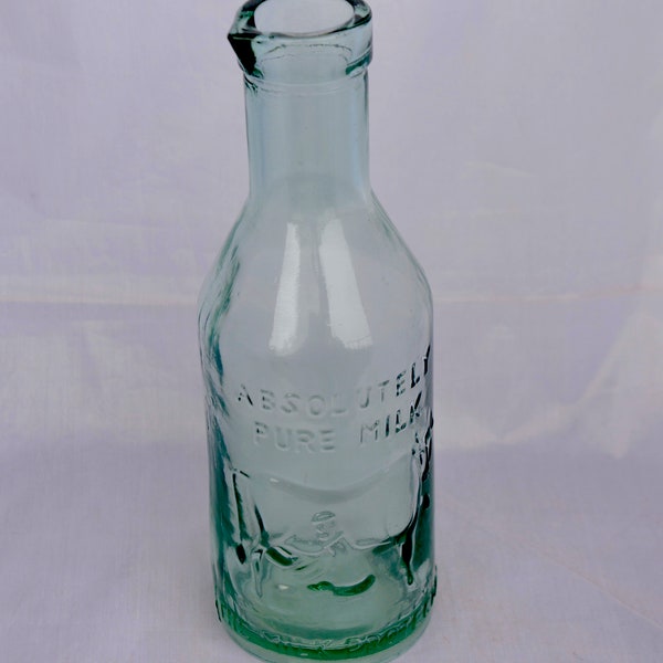 Vintage The Milk Protector, Absolutely Pure Milk, Aqua Glass Bottle Cow Emblem.