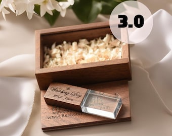 May include: A wooden box containing a clear crystal USB drive. The USB drive is engraved with the text "Wedding Day #SDS_Video www.Reshetar.com".