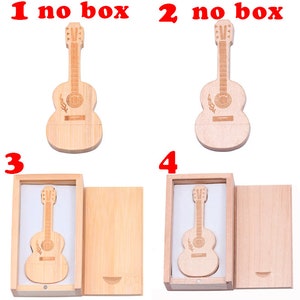 May include: Four wooden guitar shaped USB flash drives. Two drives are shown in a wooden box with a lid. The other two drives are shown without a box.