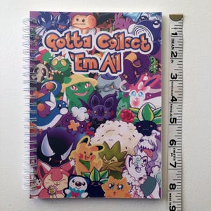 Image showing the length of the sticker book using a fabric ruler. It is 8.27 inches long