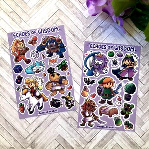 May include: Two purple sticker sheets with colorful cartoon illustrations. One sheet features a variety of characters and objects, including a cat-like figure, a blue creature, and a warrior. The other sheet has a harp-playing figure, a green-clad character, and a bed.