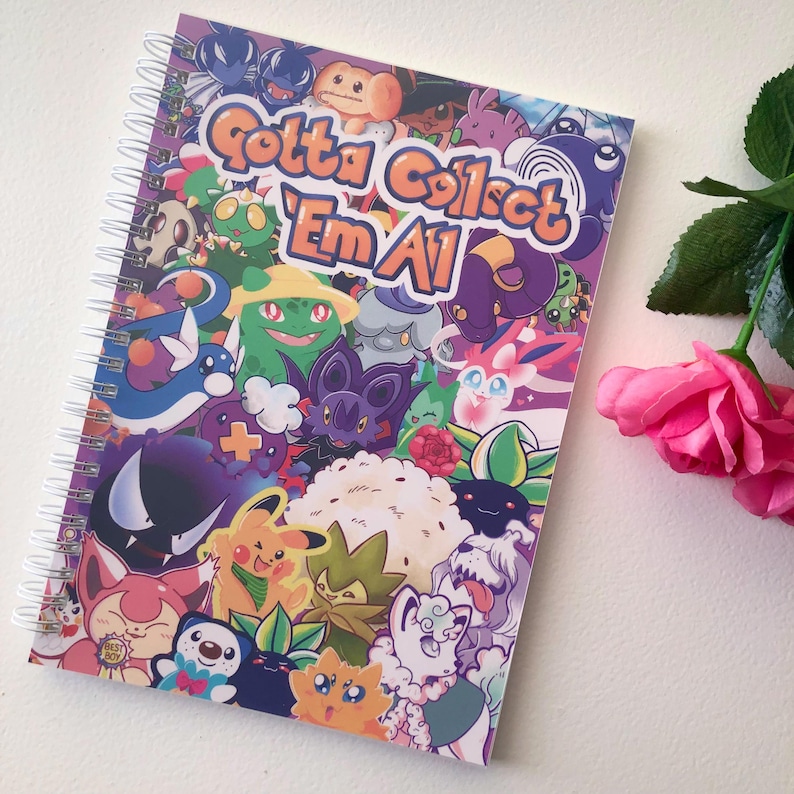 Cover image of the sticker book. It is a combination of lots of different pokemon characters I have drawn all put together to create a fun, dynamic sticker book. The words "Gotta Collect 'Em All" are hand written at the top of the book.