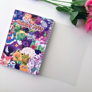 Image of the back of the sticker book lying open, with the frosted clear plastic protective cover open revealing the card stock decorative back cover underneath.