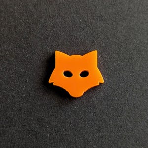 May include: Orange plastic fox head cutout.