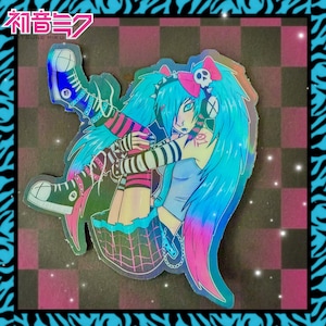 May include: Holographic sticker featuring a stylized anime character with long, turquoise hair and a pink bow with a skull. The character wears a blue top, black and pink striped arm warmers, and black sneakers. The sticker has a checkered background and the text "Hatsune Miku".