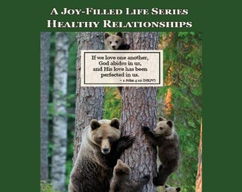 May include: A book cover with the title "A Joy-Filled Life Series Healthy Relationships." The image features a family of brown bears climbing a tree. A sign on the tree reads, "If we love one another, God abides in us, and His love has been perfected in us."