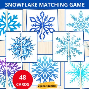 May include: A snowflake matching game with 48 cards. The cards feature blue, purple and turquoise snowflakes with glitter and watercolour designs. The game is designed for 2-piece puzzles.