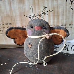Primitive Butterfly decoration with orange wings rustic twine tie and rusty jingle bell
