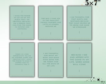 May include: Twenty affirmation cards with a green background and white text. The cards are 5 inches by 7 inches. The text on the cards includes positive affirmations about gratitude, growth, and self-love.