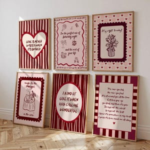 May include: Six framed art prints with romantic quotes and illustrations. The prints feature a colour palette of red, white, and pink. The frames are a light brown colour. The prints have various designs, including hearts, flowers, and text.