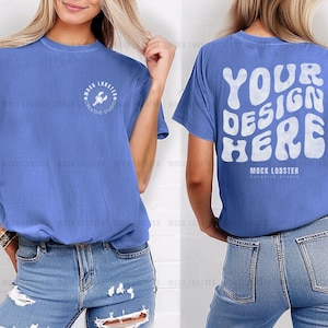 May include: A blue t-shirt with a white graphic of a lobster and the text "Mock Lobster Creative Studio" on the front and the text "Your Design Here" on the back.