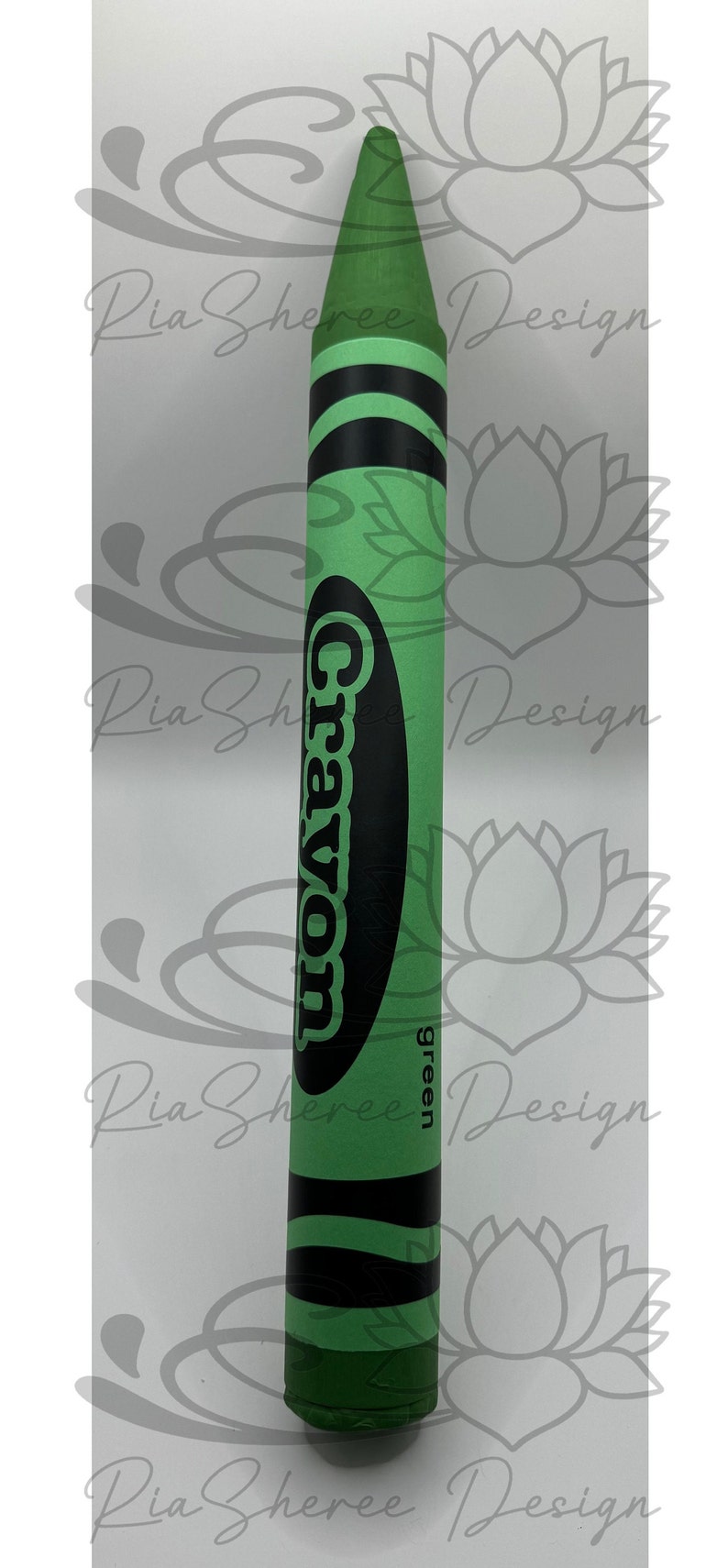 A green fake crayon with black lettering that reads 'Crayon' and 'green'.