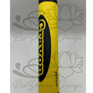 A yellow fake crayon with black lettering that reads 'Crayon' and 'yellow'.