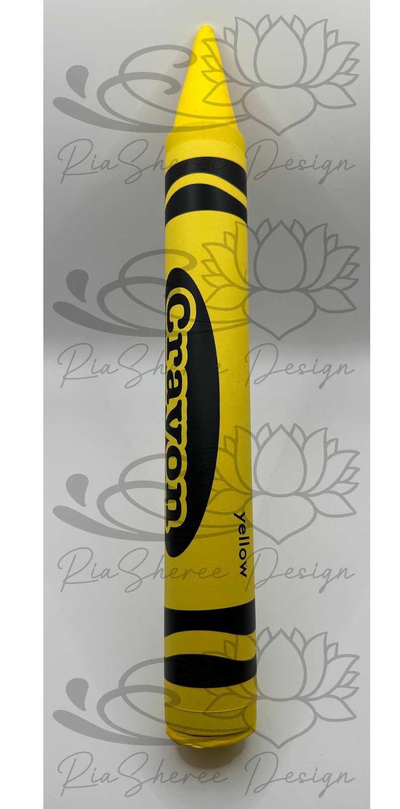 A yellow fake crayon with black lettering that reads 'Crayon' and 'yellow'.