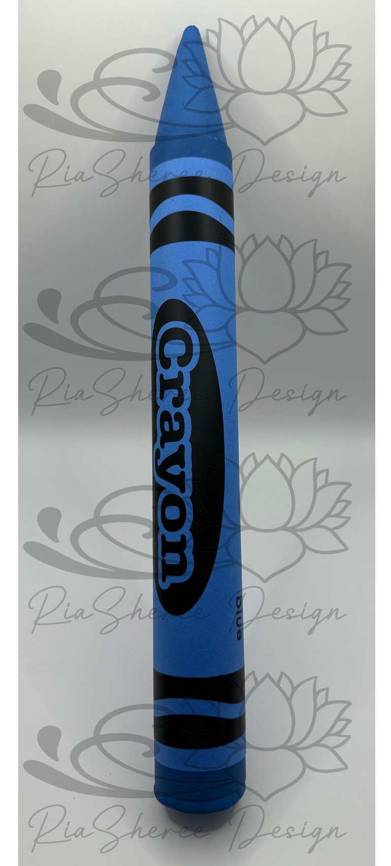 A blue fake crayon with black lettering that reads 'Crayon' and 'blue'.