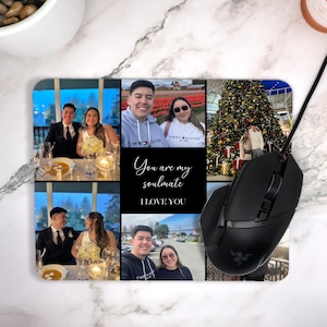 May include: Rectangular mousepad featuring a collage of six photos. The photos show couples in various settings. The mousepad has the text "You are my soulmate I LOVE YOU" on a black background. A black computer mouse is on the right.