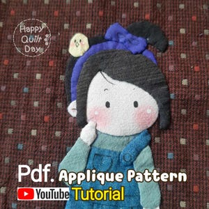 May include: A PDF applique pattern tutorial for a girl with a blue bow in her hair. The tutorial is available on YouTube.