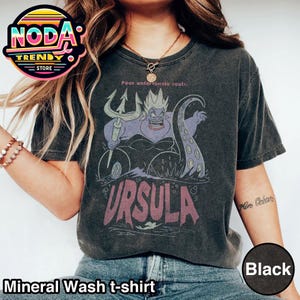 May include: Black mineral wash t-shirt featuring a graphic of Ursula from The Little Mermaid, with the text "Poor unfortunate souls" above and "URSULA" below. The shirt has a vintage look.