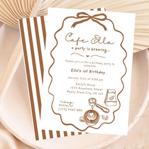 May include: A white invitation card with brown text and illustrations, featuring the text "Cafe Ella" and "a party is brewing..." The invitation is for Ella's 1st Birthday, with date, time, and location details. A second card with brown stripes is visible.