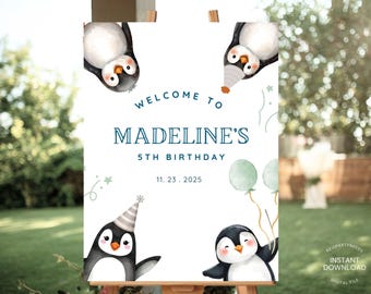 May include: A white birthday sign with the text "Welcome to Madeline's 5th Birthday" and the date 11.23.2025. The sign features penguin illustrations and is displayed on a wooden easel. The penguins are wearing party hats and holding balloons.