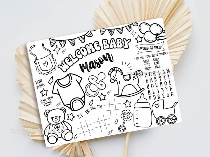 May include: A black and white printable baby shower game with a welcome baby Mason banner, a word search, tic-tac-toe, and other baby-themed images.