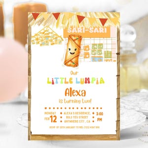 May include: A custom invitation with a wooden frame, featuring a cartoon lumpia and the text "Our Little Lumpia Alexa is turning two!" Details include date, time, and location.