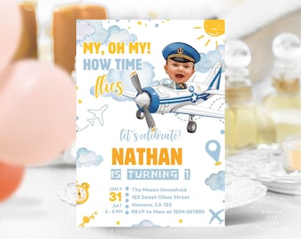 May include: A birthday invitation featuring a cartoon airplane with a child's face in the cockpit. The invitation has a blue and yellow color scheme with the text "MY, OH MY! HOW TIME flies" and "NATHAN IS TURNING 1".
