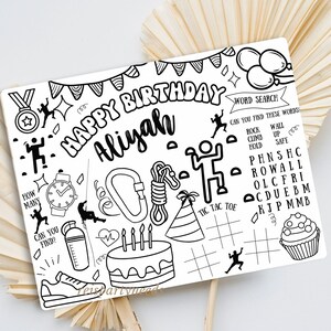 May include: A black and white printable birthday activity sheet with the words "Happy Birthday Aliyan" and a variety of climbing-themed illustrations, including a rock climbing wall, a rope, a carabiner, a watch, a water bottle, a heart, a birthday cake, and a cupcake. The sheet also includes a word search puzzle and a tic-tac-toe game.