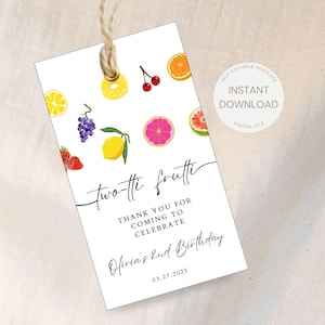 May include: A white thank you tag with a colorful fruit design. The text reads "two-tti frutti" and "Thank you for coming to celebrate Olivia's 2nd Birthday 03.27.2025".