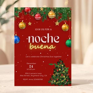 May include: A red invitation card with the words "noche buena" in white and yellow. The card features Christmas ornaments, a Christmas tree, and the date December 24.