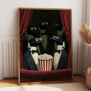 May include: A framed wall art print depicting five penguins wearing black tuxedos, bow ties, and round spectacles. The penguins are positioned behind a red velvet theater curtain and a balcony railing, with a striped bucket of popcorn in the center.