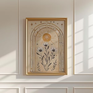 May include: Framed art print with a celestial theme. The artwork depicts a golden sun, an arch, stars, and monochrome flowers. The gold frame complements the artwork's bohemian style. The print is in a gold frame.