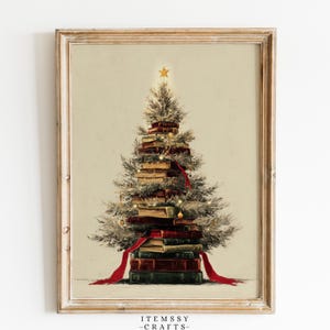 May include: A framed wall art print featuring a Christmas tree constructed from a stack of vintage books. The tree is decorated with small lights, a gold star topper, and a red ribbon draped around the books. The text ITEMSSY-CRAFTS appears below.