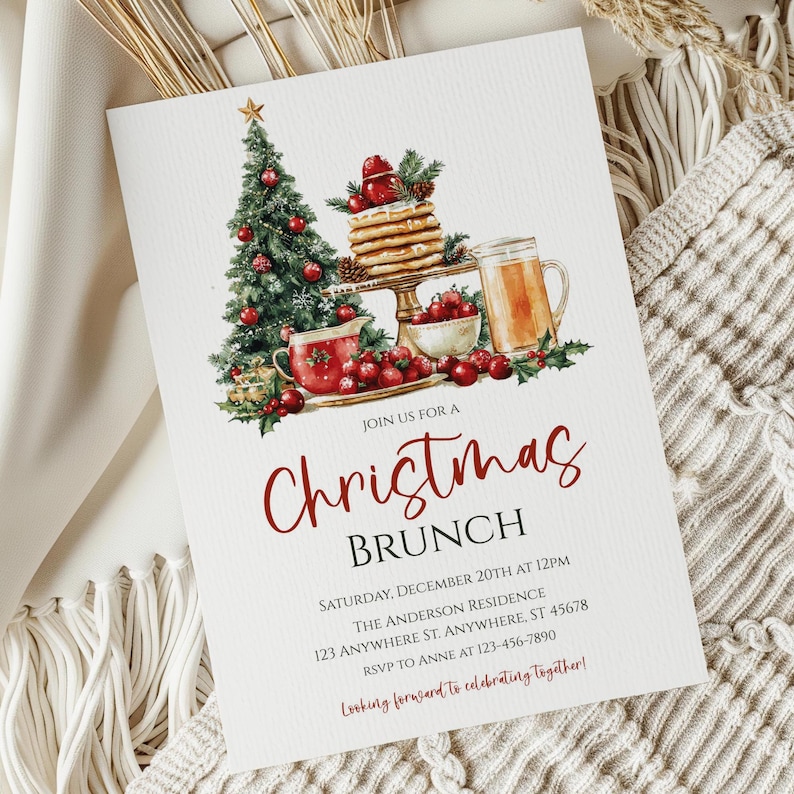 May include: Christmas brunch invitation with watercolor illustrations of a decorated Christmas tree, pancakes, a mug of cider, and berries. The invitation text is in red script and includes event details.