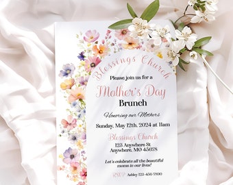 May include: A floral-themed invitation for a Mother's Day brunch at Blessings Church. The invitation features a watercolor illustration of pink, purple, and yellow flowers. The text reads "Blessings Church", "Please join us for a Mother's Day Brunch", "Honoring our Mothers", "Sunday, May 12th, 2024 at 11am", "Blessings Church", "123 Anywhere St", "Anywhere, MO 45678", "Let's celebrate all the beautiful moms in our lives!" and "RSVP Ashley 123-456-7890".