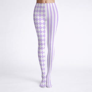 May include: A pair of leggings with a unique design. One leg features a pattern of white and lavender diamonds, while the other leg has vertical lavender and white stripes. The leggings are made of a soft, stretchy material.