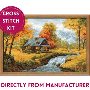 May include: Cross stitch kit featuring a cabin in a forest setting with a stream flowing through the scene. The cabin is brown with a gray roof and a porch. The trees are a mix of green and orange, and the mountains in the background are blue. The kit includes all the materials needed to complete the cross stitch project.