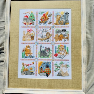 The RIOLIS cross stitch kit Cat Calendar features a charming calendar design with cats, using 29 colors of wool/acrylic threads. The kit includes a needle, Zweigart 14ct white AIDA fabric, and a color chart. The finished size is 30x40 cm.