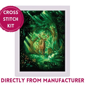 May include: Cross stitch kit featuring a deer standing in a magical forest with glowing lights. The kit includes all the materials needed to complete the project.