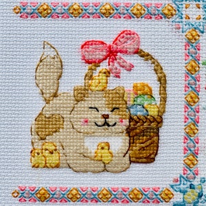 The RIOLIS cross stitch kit Cat Calendar features a charming calendar design with cats, using 29 colors of wool/acrylic threads. The kit includes a needle, Zweigart 14ct white AIDA fabric, and a color chart. The finished size is 30x40 cm.