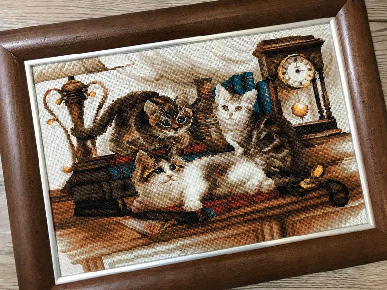 The RIOLIS cross stitch kit Furry Friends features beautiful three kittens playing. The kit includes wool acrylic threads in 20 colors, a needle, Zweigart 14ct flaxen AIDA fabric and a color chart. The finished size is 40x30 cm