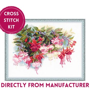 May include: Cross stitch kit featuring a floral design of pink and red fuchsia flowers with green leaves. The design is framed in a white frame with a decorative border.