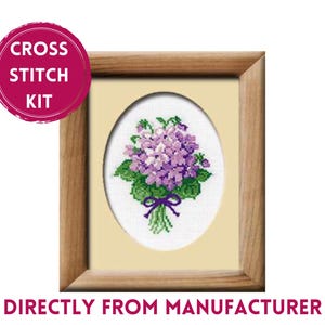 May include: Cross stitch kit featuring a framed image of a bouquet of purple violets with green leaves and a purple ribbon.