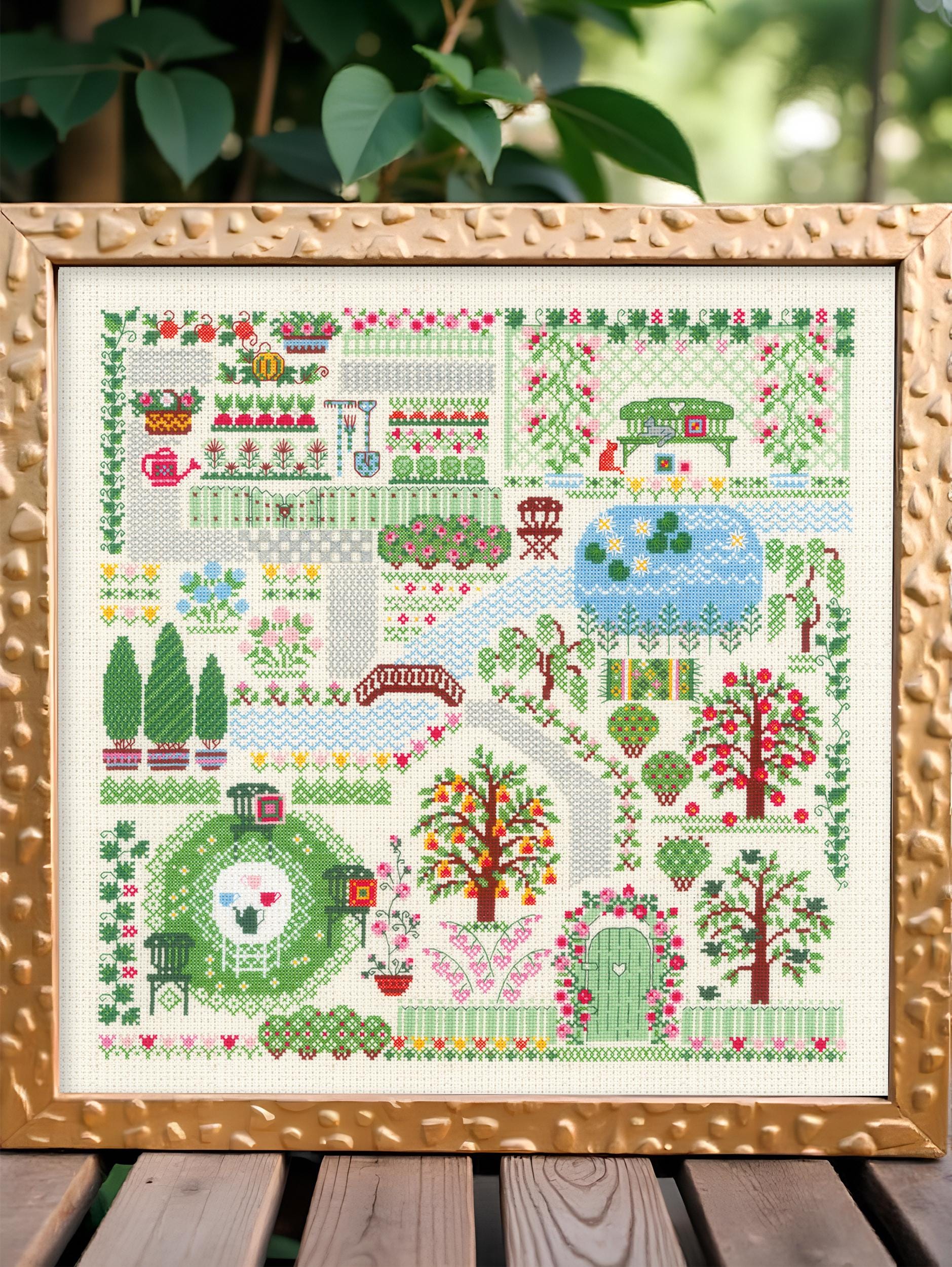 Kit à broder maisonnette au jardin fleuri R978 chez RIOLIS