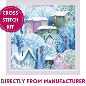 May include: Cross stitch kit featuring a winter scene with houses and trees covered in snow. The houses are painted in shades of blue, pink, and green. The trees are a soft blue and white. The kit includes all the materials needed to complete the project. "Cross Stitch Kit" is written in a red circle at the top left of the image.