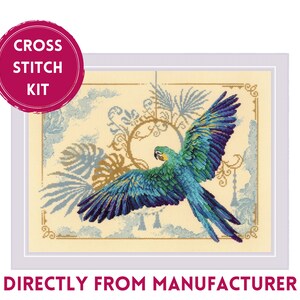 May include: Cross stitch kit featuring a colorful parrot with outstretched wings against a background of stylized foliage and clouds. The kit includes all the materials needed to complete the project.
