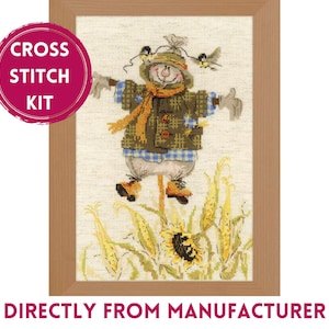 May include: Cross stitch kit featuring a whimsical scarecrow with a brown jacket, blue and white plaid shirt, and a brown hat. The scarecrow is standing in a field of sunflowers and corn.
