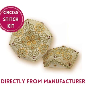 May include: Cross stitch kit with two finished, beaded, hexagonal cushions. The cushions are beige with a green and gold geometric pattern.